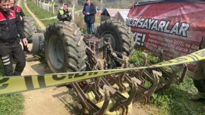 Bursa'da devrilen traktörünün altında kalan
